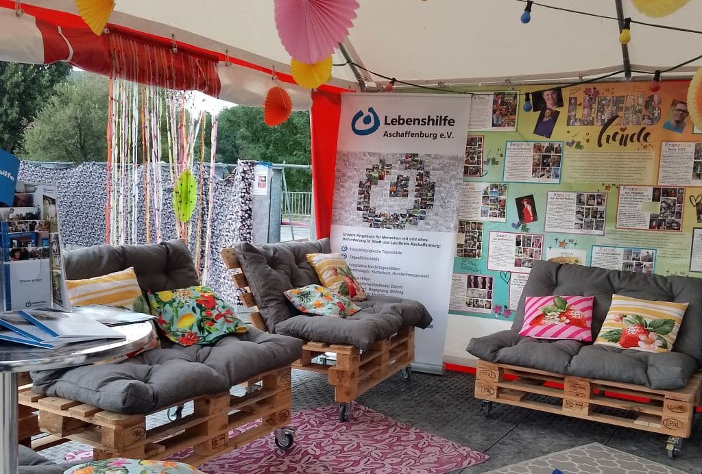 Stand der Lebenshilfe Aschaffenburg und den Lebenshilfe Werkstätten Schmerlenbach, Titel
